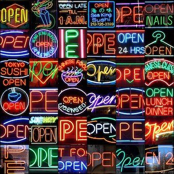Neon lit open signs stacked on top of each other
